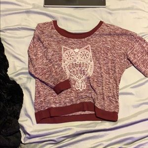 Maroon and white owl sweater.